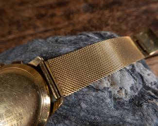 An 18K gold Chronograph Swiss made men's watch made by Eberhard & Co. Circa 1940's. 8 inch band with a 38mm case diameter with crown and 42mm lug to lug. Total weight 85 grams.