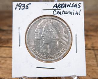 A 1936 50C Arkansas Centennial commemorative half-dollar. Extremely high detail and quality. Estimated high UNC condition.