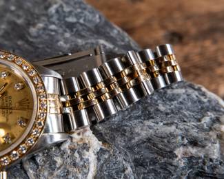An Oyster Perpetual Datejust lady's bracelet watch. With an 18k yellow gold and diamond bezel, synthetic sapphire crystal, and a Rolex Oyster Perpetual certified chronometer automatic movement with date. Fitted with a stainless steel and 18k yellow gold Jubilee bracelet. Total weight 53.52 grams. Comes with official assessment paperwork from Pacific Gemological Laboratory INC.
