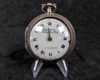 A silver pocket watch and silver case with an enamel face and Roman numerals. Made by watchmaker Gugenmus Horloger Du Roy of Warsaw, Poland. Circa 1790's. The face and back of the movement are both marked with the makers name. The back of the movement had a unique glass cover. The interior hinge is missing the pin and the outer glass cover is loose.