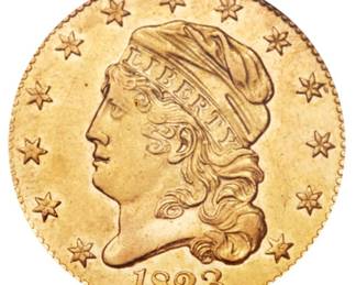 An 1823 $5 Capped Bust Half-Eagle Gold Coin. Graded an AU-50 by NGC. This coin also has a CAC Gold Sticker, meaning CAC believes the quality of the coin may warrant a higher grade. It is estimated there are 80 to 100 surviving examples of this coin. The design features are well brought up in most areas. The semi-reflective green-gold surfaces display pleasing coral color near the peripheries.