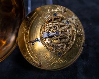 An 18k gold pocket watch with an enameled face and Arabic numerals. Made by watchmaker Pehr Ramstedt of Stockholm Sweden. Circa 1780's. The back of the movement has a jeweled center and is engraved with the makers information as well as "No. 54". No key.