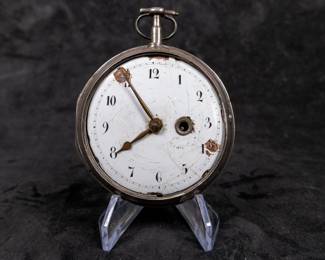 A silver pocket watch with an enamel face and Arabic numerals. The back movement has a center jewel. Made by watchmaker Franz Georg Rothea of Strasbourg, France. Rothea was active making watches between 1737-1742. This watch is missing it's glass dome and has no key.