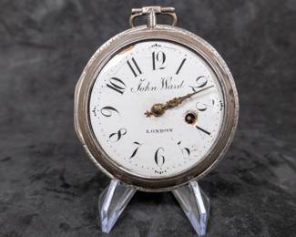 A silver pocket watch in a silver case with an enamel face and Arabic numerals, made by watchmaker John Ward of London, Late 18th Century. The movement on the back is signed "John Ward Fore Street London" Number 2690. The back movements shows a monogram of King George III, with two "G"s one reversed, and the Roman numerals III with a crown affixed on top. This watch is missing it's glass cover, and has a damaged hinge and watch hand.