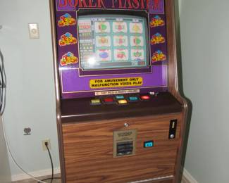 Slot machine- this machine came from Wiggers tavern in Silver lake, MO.  Sure wish we had the tree stump barstools to go with!  IYKYK
