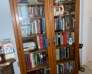 Large glass front cabinet, old books, figurines 
