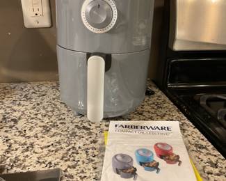 Faberware appliance and many boxed new dishes and electric items. Large Roasting pan, large toaster oven, wine glasses and lots more