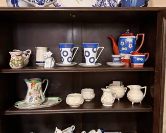 Assortment of Delft figurines, Belleek China, and Japanese pottery