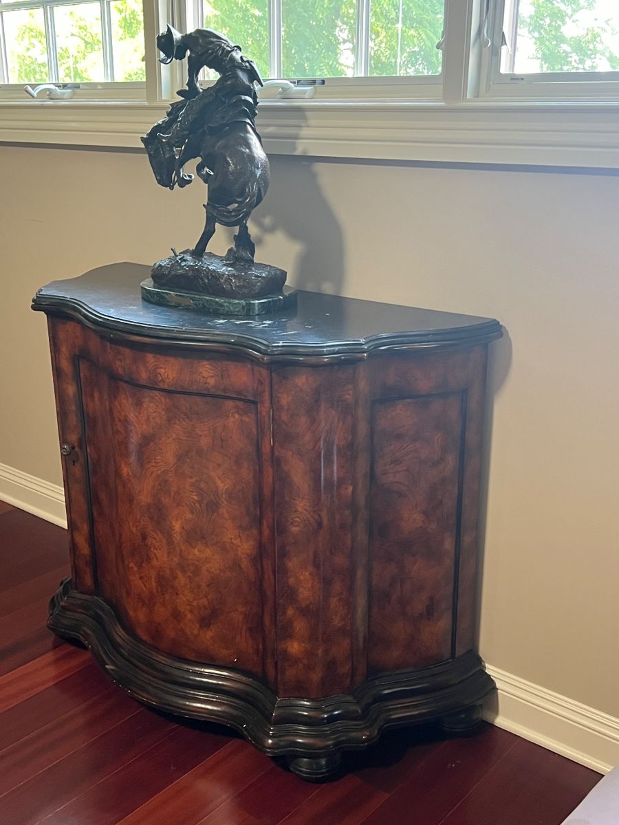 FREDERIC REMINGTON ‘Rattlesnake’ Bronze Sculpture
Signed.  Perched atop a RALPH LAUREN Console.