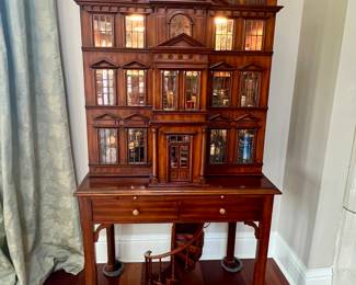 Fabulous & Elegant Maitland-Smith Georgian Mahogany Dollhouse Bar Cabinet. Finished Dollhouse Bar Cabinet with Paris Brass Accents. Front opens to reveal Mirrored Bar with Single Glass Shelf and Lighted Hutch. Also features 2 drawers and a slide out Tooled Leather Surface for Mixing Cocktails.