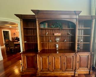 RETRACTABLE TV WALL UNIT or can be converted to a bookshelf with the push of a button.