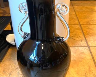 Black/clear glass. Pontil mark but no signature