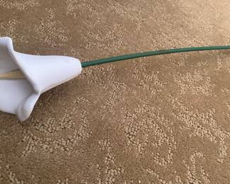 One of three large carved wooden calla lilies