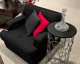 Matching black chairs, crystal decanter
