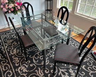 Glass top dining table, area rug