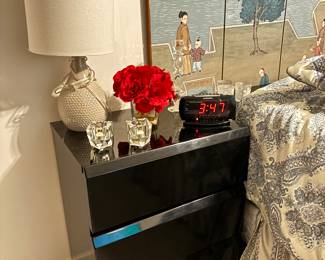 Matching sleek black nightstands