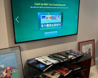 Flat screen smart tv, tv stand, coffee table books