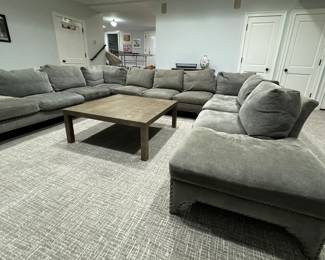 Three-Piece Moleskin Grey Upholstered Sectional Sofa with Contrasting Moleskin Grey Herringbone Fabric on Middle Section. Left Section Measures 116" x Middle Section Measures 154" x Right Section Measures 116". Photo 2 of 8.