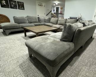 Three-Piece Moleskin Grey Upholstered Sectional Sofa with Contrasting Moleskin Grey Herringbone Fabric on Middle Section. Left Section Measures 116" x Middle Section Measures 154" x Right Section Measures 116". Photo 4 of 8.