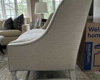 High-Back Down-Filled Settee Upholstered in Neutral Fabric with Light Grey Leather Trim. Measures 57" W x 34" D. Photo 2 of 4.