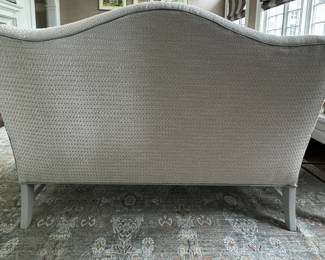 High-Back Down-Filled Settee Upholstered in Neutral Fabric with Light Grey Leather Trim. Measures 57" W x 34" D. Photo 3 of 4.