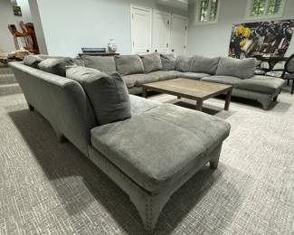 Three-Piece Moleskin Grey Upholstered Sectional Sofa with Contrasting Moleskin Grey Herringbone Fabric on Middle Section. Left Section Measures 116" x Middle Section Measures 154" x Right Section Measures 116". Photo 1 of 8.