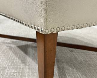 Baker Furniture Ottoman Upholstered In Textured Cream Faux Leather Fabric and Finished with Nailhead Trim. Measures 26" x 36" x 18.5" H. Photo 4 of 4.