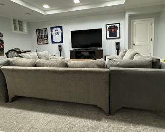 Three-Piece Moleskin Grey Upholstered Sectional Sofa with Contrasting Moleskin Grey Herringbone Fabric on Middle Section. Left Section Measures 116" x Middle Section Measures 154" x Right Section Measures 116". Photo 6 of 8.