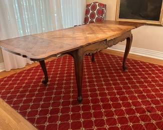 T21 - $325. Expandable French Table with Parquet Top. Measures 35" wide x 54.5" long x 30" tall. Each leaf adds 20". Top has signs of use - maybe sun fading? Structurally sound!