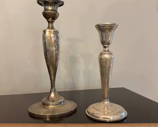 T207 - Left to Right. $225 Tiffany & Co mdoel B12 weighted Sterling candlestick. 9.25" tall. Monogrammed "HBC". $45 Cartier Preisner 722 Weighted Candlestick. 7.25" tall. 