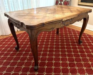 T21 - $325. Expandable French Table with Parquet Top. Measures 35" wide x 54.5" long x 30" tall. Each leaf adds 20". Top has signs of use - maybe sun fading? Structurally sound!
