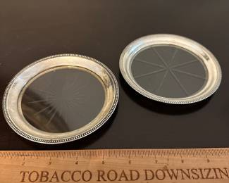 T202 - $20 each Sterling Rimmed Wine Bottle Coaster