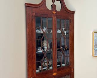 T9 - $395 - Antique Corner Cabinet. Measures 36" across the front. 26.5" out from each corner. 91" tall. Very good antique condition except 2 panels of glass that are cracked. Both are in the bottom left corner. The rest of the glass is wavy. 