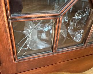 T9 - $395 - Antique Corner Cabinet. Measures 36" across the front. 26.5" out from each corner. 91" tall. Very good antique condition except 2 panels of glass that are cracked. Both are in the bottom left corner. The rest of the glass is wavy. 