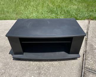 Black TV stand on casters $ 25.00