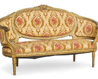 Lot 1049
Louis XVI Style Carved Walnut & Gilt Settee, Music Theme Crest, Ca. 19th C., H 48" W 74" Depth 30"