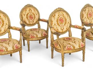 Lot 1048
Louis XVI Style Set of Walnut Gilt Open Arm Chairs, Music Theme Crests, Ca. 19th C., H 48" W 30" 4 pcs