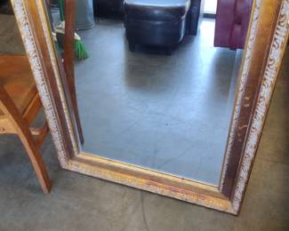 Large ornate gold framed mirror with beveled glass