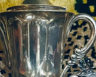 Classic lines with a scrolled handle.  TAXCO sterling is not cement or fiber filled.