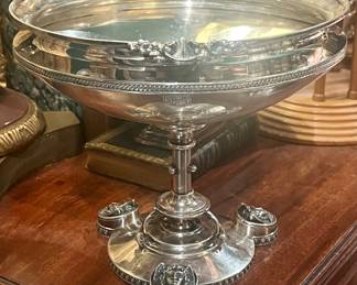 A late 1860s massive sterling silver compote…aesthetic period pedestaled bowl featuring medallions of winged Mercury faces.