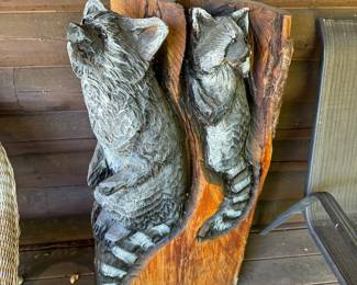 Two raccoons wood carving