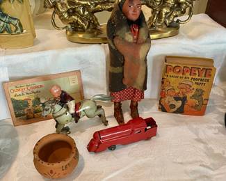 Vintage toy items, with Native American Indian doll, Antique metal train engine and more.