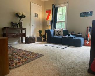 Pottery Barn Teen Locker Bin, Louisville Slugger baseball bat, Pottery Barn Teen Lounge Chair with Ottoman,	Number 7 cork board, Decor storage box, 	Faux potted Pier 1 plants, Pottery Barn throw pillow, Company C Argyle 3' x 5' rug, Table Lamp