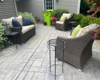 Frontgate loveseat, Various outdoor planters, Lanterns, Decorative pillows, Decorative pillows. Outdoor tables, Frontgate Chair A,  Frontgate Chair B
