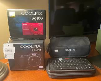 Nikon Coolpix S6100 Camera, Tumi Keyboard, Sony Handycam DCR-HC30