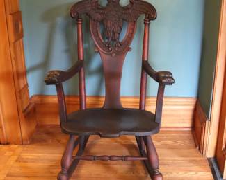 A 19th century Victorian Period rocking chair. Mahogany construction with full bodied carved Owl crest over a shaped seat and curved arms with Lion masks and stretcher base with turned rail. Old dark finish with some wear, shrinkage particularly to seat front. 21 3/4 x 31 x 40 1/2" high overall. ESTIMATE $100-200 NOTE: This lot picks up from the home in Coldwater, Michigan.