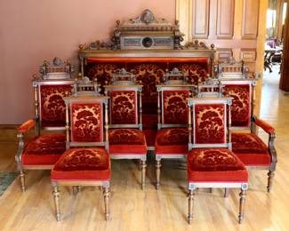 A 19th century Victorian Period seven piece parlor set. Carved Walnut frames with galleried crests over turned side rails, upholstered backs and seats on turned legs. Includes a settee, two armchairs and four side chairs. Older finish with some wear, minor damage and shrinkage, original burnout mohair upholstery with some wear. Settee is 65 x 30 x 68" high overall, armchairs 24 x 23 x 48" high overall, sidechairs 18 x 19 x 43 1/2" high overall. NOTE: This lot picks up from the home in Coldwater, Michigan.