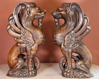A pair of 19th century Victorian Period carved wooden Griffon corbel figures. Older finish with some wear and minor damage, some insect damage. Each 5 x 9 x 17 1/2" high overall. NOTE: This lot picks up from the home in Coldwater, Michigan.