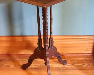 A 19th century Victorian Period plant stand. Mahogany construction with carved detail, inlaid Ebony top with foliate design over a turned stem and tripod base with scrolled feet. Old finish with some wear, shrinkage, wear to Gilded accents. 18 3/4 x 19 x 32 3/4" high overall. ESTIMATE $50-100 NOTE: This lot picks up from the home in Coldwater, Michigan.