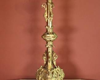 A 19th century Neoclassical Bronze altar stick. Pierced tops over a columnar stem with applied Dragons and acanthus details on pierced base with Phoenix form feet. Wear to original Gilded finish, some oxidation and pitting. 11 x 11 x 31 1/2" high overall. NOTE: This lot picks up from the home in Coldwater, Michigan.